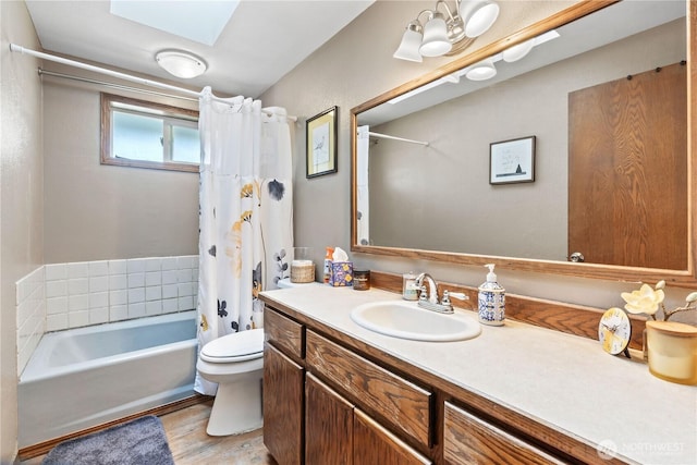 2219 W Pioneer Ave, Puyallup, WA 98371 - bathroom featuring toilet, a skylight, vanity, and shower / tub combo