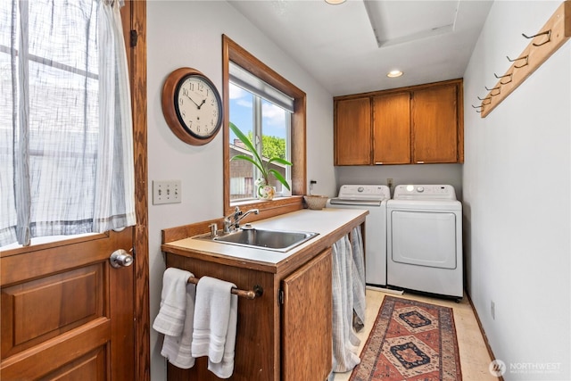 2219 W Pioneer Ave, Puyallup, WA 98371 - washroom featuring washing machine and clothes dryer, cabinet space, attic access, and recessed lighting