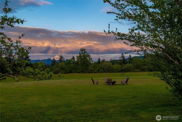 view of home's community with a yard and a mountain view