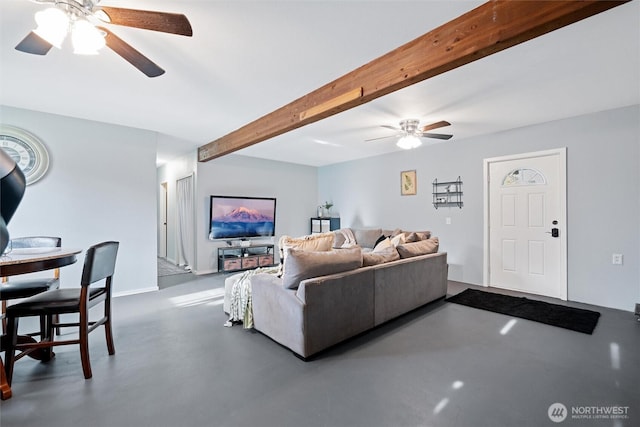 living area with ceiling fan and beamed ceiling