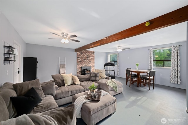 living room with ceiling fan, finished concrete floors, and beam ceiling