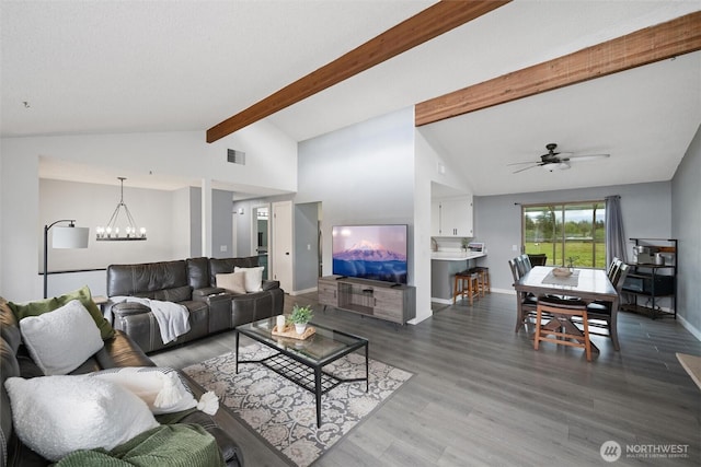 living area with a chandelier, wood finished floors, baseboards, and a ceiling fan