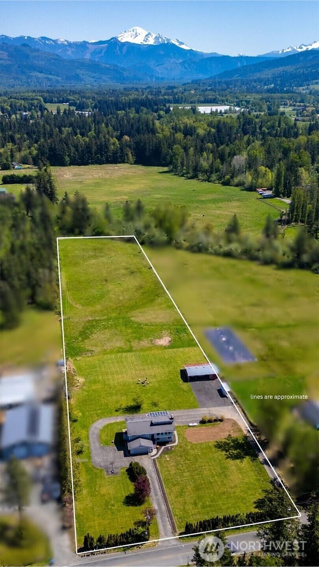 overview of rural landscape featuring property boundaries highlighted and a mountain backdrop