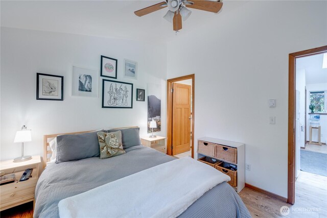 7537 Canyon View Dr, Glacier, WA 98244 - bedroom with light wood-type flooring, baseboards, lofted ceiling, ceiling fan, and ensuite bathroom