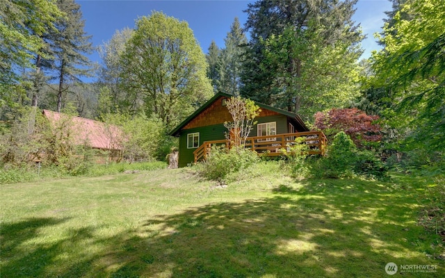 7537 Canyon View Dr, Glacier, WA 98244 - view of green lawn featuring a wooden deck and a view of trees