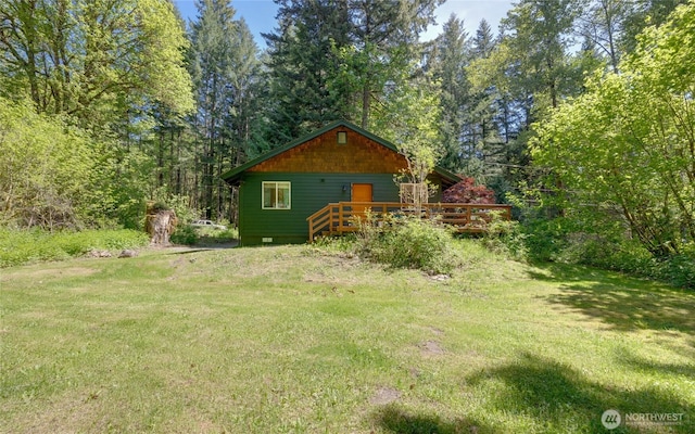 7537 Canyon View Dr, Glacier, WA 98244 - view of grassy yard featuring a wooden deck and a wooded view