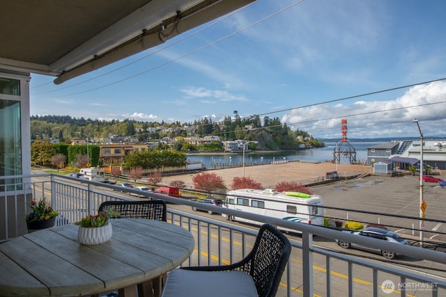 balcony featuring a water view