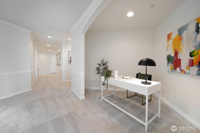 office featuring carpet flooring, ornamental molding, baseboards, arched walkways, and recessed lighting