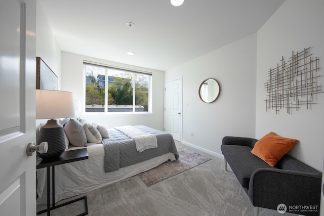 bedroom featuring carpet flooring and baseboards