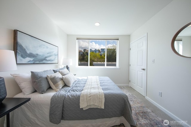 bedroom with carpet, baseboards, and recessed lighting