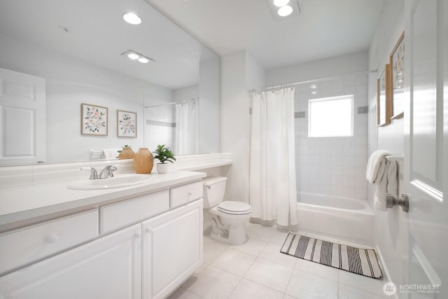 full bath with tile patterned flooring, toilet, vanity, and shower / bath combo with shower curtain
