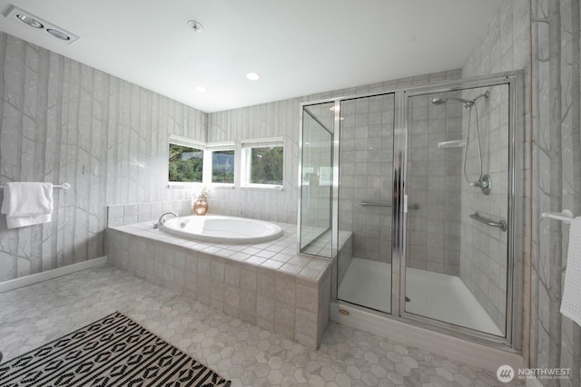 bathroom with a shower stall, a garden tub, tile patterned flooring, and recessed lighting