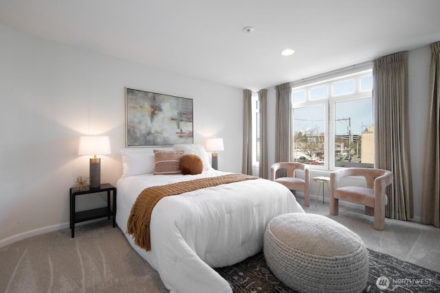 bedroom with carpet and baseboards