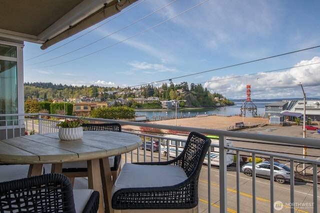 balcony featuring a water view