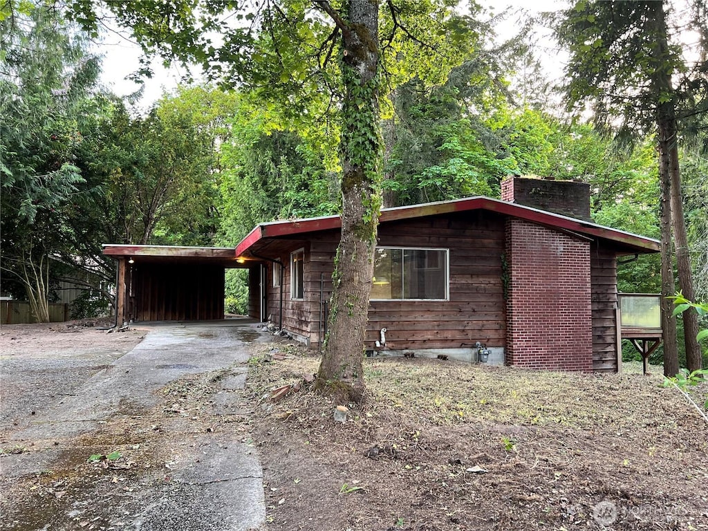 4705 119th Ave SE, Bellevue, WA 98006 - single story home featuring driveway, a chimney, and an attached carport