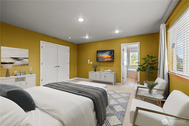 bedroom with recessed lighting, baseboards, a closet, and connected bathroom