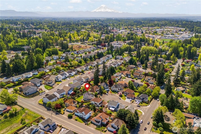 aerial view of residential area featuring a mountain backdrop