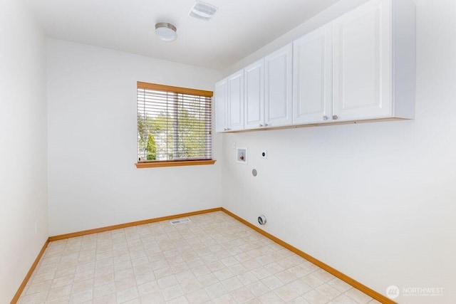 washroom featuring cabinet space, electric dryer hookup, washer hookup, and baseboards