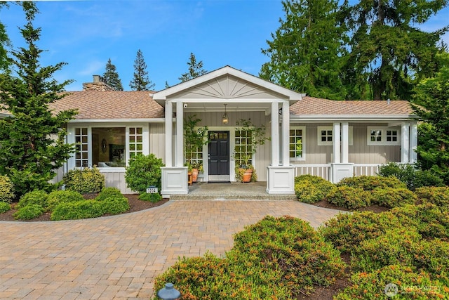 3204 Evergreen Point Rd, Medina, WA 98039 - ranch-style house featuring a porch, a chimney, and board and batten siding