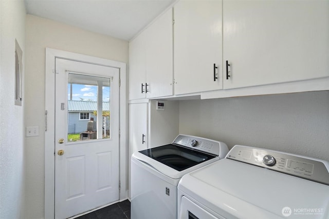 166 SW Lewis St, Chehalis, WA 98532 - laundry room with cabinet space, washing machine and clothes dryer, and dark tile patterned floors