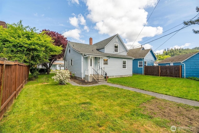 166 SW Lewis St, Chehalis, WA 98532 - back of property featuring entry steps, a chimney, and roof with shingles