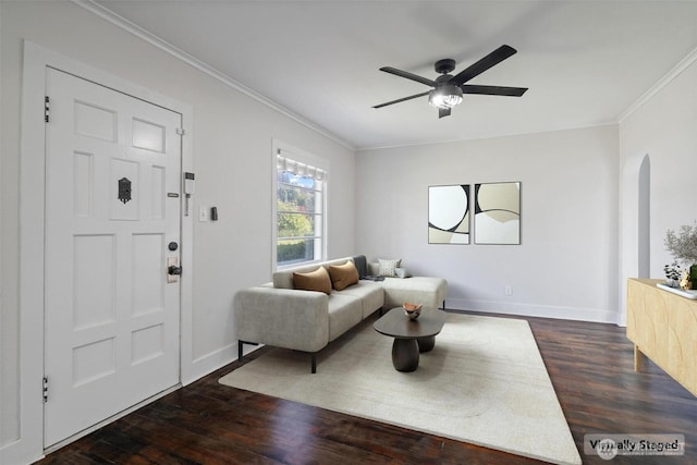 166 SW Lewis St, Chehalis, WA 98532 - living area featuring arched walkways, dark wood-style floors, ornamental molding, ceiling fan, and baseboards