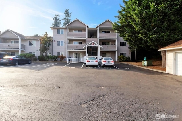 view of property with uncovered parking