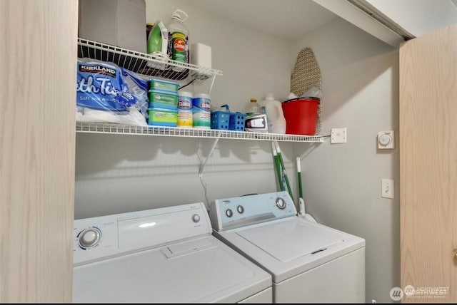 washroom featuring washer and clothes dryer