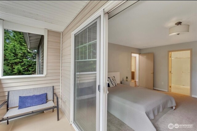 carpeted bedroom featuring baseboards