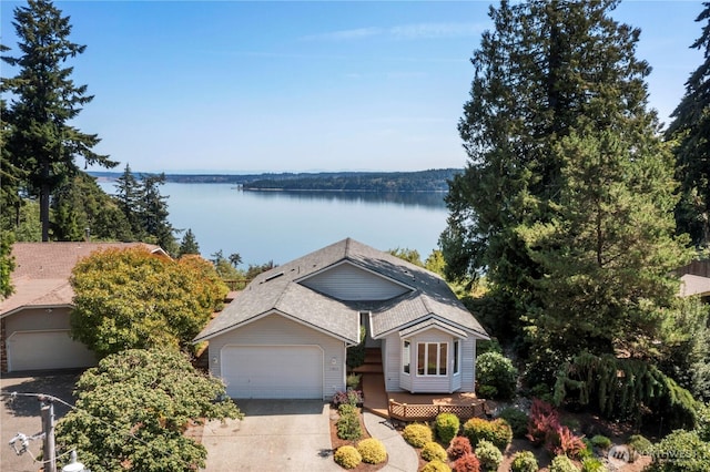 11011 Seaview Dr, Anderson Island, WA 98303 - ranch-style home featuring driveway and a deck with water view