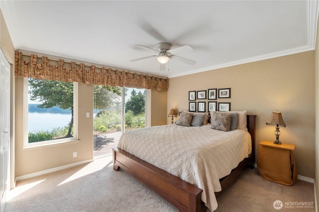 11011 Seaview Dr, Anderson Island, WA 98303 - carpeted bedroom featuring access to exterior, baseboards, crown molding, and a ceiling fan