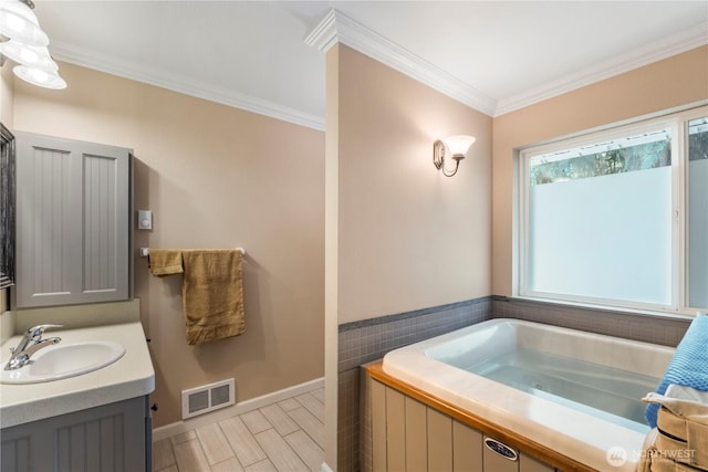 11011 Seaview Dr, Anderson Island, WA 98303 - bathroom featuring crown molding, a bath, baseboards, vanity, and wood tiled floors