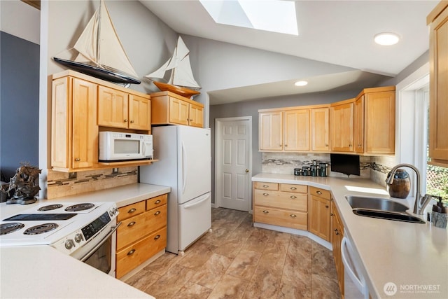 11011 Seaview Dr, Anderson Island, WA 98303 - kitchen featuring white appliances, a sink, a skylight, light brown cabinets, and decorative backsplash