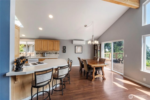 11011 Seaview Dr, Anderson Island, WA 98303 - dining space with dark wood-type flooring, baseboards, a chandelier, plenty of natural light, and recessed lighting