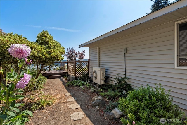 11011 Seaview Dr, Anderson Island, WA 98303 - view of home's exterior featuring a wooden deck and ac unit