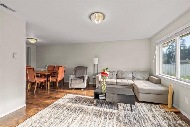 17001 17th Avenue Ct E, Spanaway, WA 98387 - living area featuring wood finished floors and baseboards