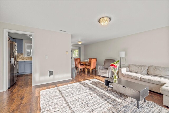 17001 17th Avenue Ct E, Spanaway, WA 98387 - living area featuring dark wood-style floors and baseboards