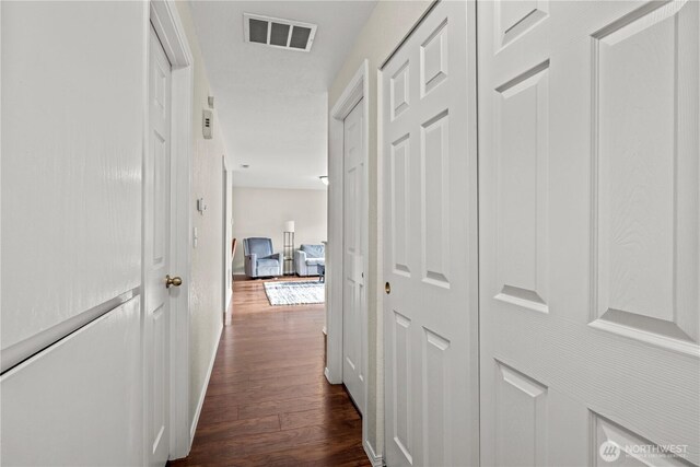 17001 17th Avenue Ct E, Spanaway, WA 98387 - hallway featuring dark wood-type flooring