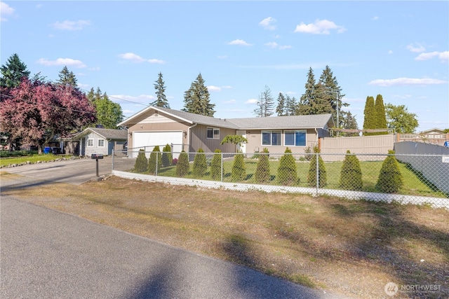17001 17th Avenue Ct E, Spanaway, WA 98387 - ranch-style house featuring a fenced front yard, a garage, and driveway