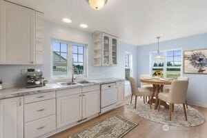 101 Briar Rose Ln, Chehalis, WA 98532 - kitchen featuring white dishwasher, plenty of natural light, light wood-style floors, white cabinetry, and recessed lighting