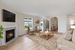 101 Briar Rose Ln, Chehalis, WA 98532 - living area featuring wood finished floors, arched walkways, and a glass covered fireplace
