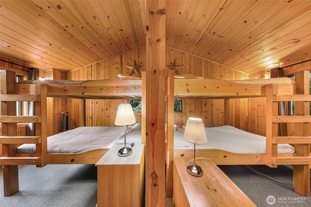 bedroom with carpet floors, wood walls, lofted ceiling, and wood ceiling