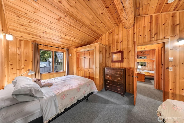 carpeted bedroom featuring lofted ceiling, wood ceiling, wooden walls, and a closet