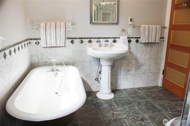 123 24th Ave, Seattle, WA 98122 - full bathroom featuring a soaking tub, tile walls, wainscoting, and radiator heating unit