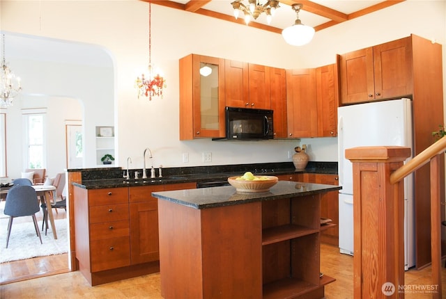 123 24th Ave, Seattle, WA 98122 - kitchen featuring a sink, black microwave, a chandelier, and freestanding refrigerator
