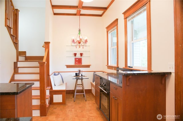123 24th Ave, Seattle, WA 98122 - dining room featuring stairway, beam ceiling, a chandelier, and coffered ceiling