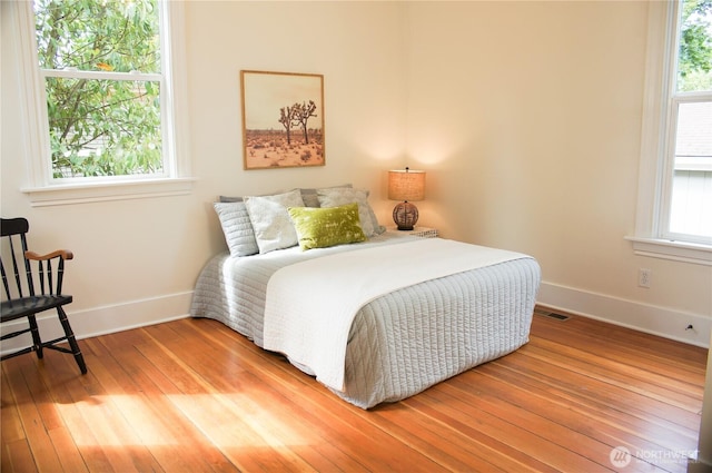 123 24th Ave, Seattle, WA 98122 - bedroom featuring baseboards and wood-type flooring