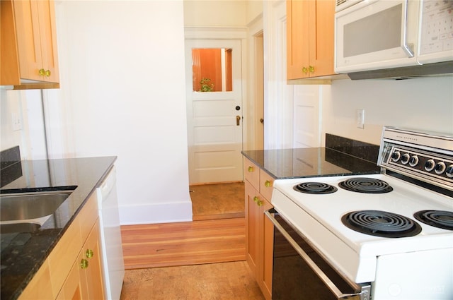 123 24th Ave, Seattle, WA 98122 - kitchen with white appliances, baseboards, dark stone counters, and a sink