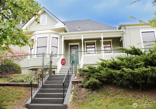 123 24th Ave, Seattle, WA 98122 - victorian house featuring a porch, roof with shingles, and stairway