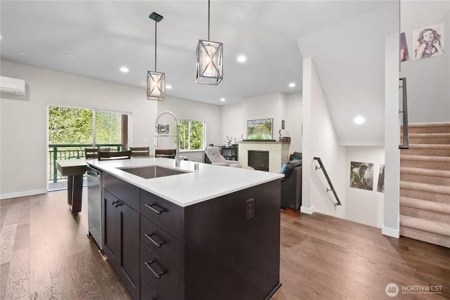1086 Collier Pl SW, Issaquah, WA 98027 - kitchen featuring a sink, a wall mounted air conditioner, dark wood-style floors, light countertops, and recessed lighting